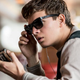 The premise is simple: People wearing headphones in movies, but they're listening to podcasts